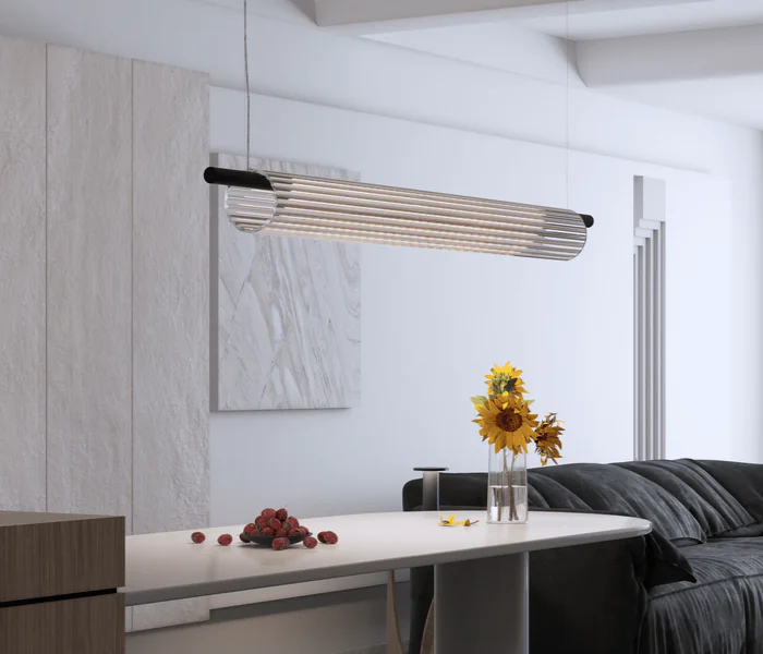 Lámpara de suspensión Glass diseñada por Josep Lluís Xuclà para Insòlit, una lámpara de suspensión elegante y de diseño limpio que destaca por su luz envolvente y presencia imponente. Fabricada con tubo de cristal estriado que crea una iluminación difusa de cristal y un efecto luminoso flotante, esta lámpara de diseño aporta sofisticación y estilo a cualquier espacio. El cuerpo está hecho en tubo de acero resistente y cuenta con un LED en PCB diseñado por Insòlit, que ofrece una iluminación de calidad y eficiente. La luminaria Glass es regulable en altura mediante dos cables de acero inoxidable y tiene un florón independiente para instalación en superficie, siendo totalmente personalizable para proyectos de iluminación de diseño, iluminación personalizada, iluminación a medida, iluminación de lujo, lighting design y suspensión. Ideal como lámpara para cocina, iluminación de locales comerciales y grandes espacios que buscan una lámpara de suspensión de cristal y diseño exclusivo, producto de iluminación de diseño premium de Insòlit. Glass representa la excelencia en lámparas de diseño, luxury lighting, iluminación difusa de cristal, iluminación de calidad y productos Insòlit Lighting, convirtiéndose en el punto focal que eleva la estética y funcionalidad del espacio. Glass pendant lamp designed by Josep Lluís Xuclà for Insòlit is an elegant, clean design pendant lamp that stands out for its immersive light and striking presence. Made with ribbed glass tubing that creates diffuse crystal lighting and a floating luminous effect, this design lamp adds sophistication and style to any space. The body is crafted from durable steel tubing and features an LED PCB designed by Insòlit, providing high-quality, efficient lighting. The Glass lamp is height-adjustable with two stainless steel cables and includes an independent canopy for surface installation, making it fully customizable for lighting design, personalized lighting, bespoke lighting, luxury lighting, lighting design, and suspension lighting projects. Ideal as a pendant lamp for kitchens, commercial lighting, and large spaces seeking an exclusive crystal pendant lamp, a premium lighting design product by Insòlit. Glass exemplifies excellence in designer lamps, luxury lighting, diffuse crystal lighting, quality lighting, and Insòlit Lighting products, becoming the focal point that enhances space aesthetics and functionality.
