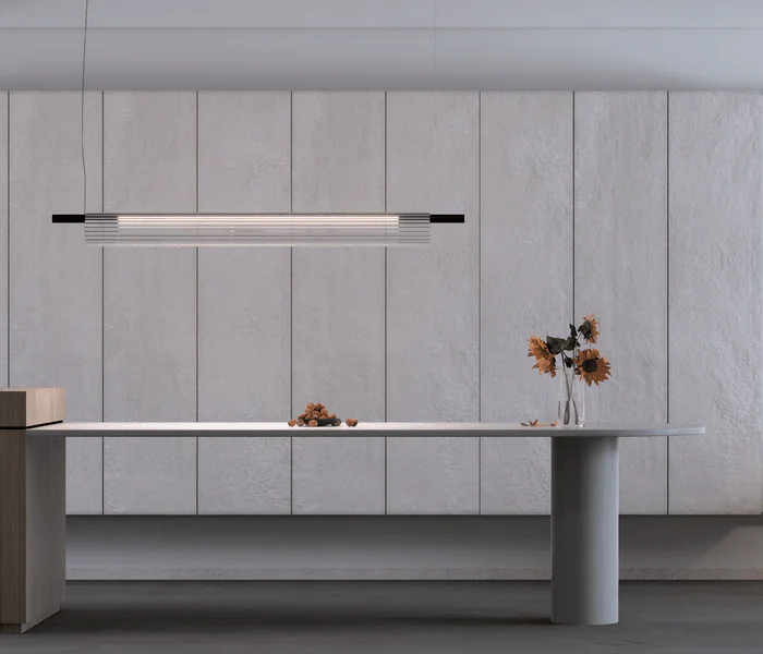Lámpara de suspensión Glass diseñada por Josep Lluís Xuclà para Insòlit, una lámpara de suspensión elegante y de diseño limpio que destaca por su luz envolvente y presencia imponente. Fabricada con tubo de cristal estriado que crea una iluminación difusa de cristal y un efecto luminoso flotante, esta lámpara de diseño aporta sofisticación y estilo a cualquier espacio. El cuerpo está hecho en tubo de acero resistente y cuenta con un LED en PCB diseñado por Insòlit, que ofrece una iluminación de calidad y eficiente. La luminaria Glass es regulable en altura mediante dos cables de acero inoxidable y tiene un florón independiente para instalación en superficie, siendo totalmente personalizable para proyectos de iluminación de diseño, iluminación personalizada, iluminación a medida, iluminación de lujo, lighting design y suspensión. Ideal como lámpara para cocina, iluminación de locales comerciales y grandes espacios que buscan una lámpara de suspensión de cristal y diseño exclusivo, producto de iluminación de diseño premium de Insòlit. Glass representa la excelencia en lámparas de diseño, luxury lighting, iluminación difusa de cristal, iluminación de calidad y productos Insòlit Lighting, convirtiéndose en el punto focal que eleva la estética y funcionalidad del espacio. Glass pendant lamp designed by Josep Lluís Xuclà for Insòlit is an elegant, clean design pendant lamp that stands out for its immersive light and striking presence. Made with ribbed glass tubing that creates diffuse crystal lighting and a floating luminous effect, this design lamp adds sophistication and style to any space. The body is crafted from durable steel tubing and features an LED PCB designed by Insòlit, providing high-quality, efficient lighting. The Glass lamp is height-adjustable with two stainless steel cables and includes an independent canopy for surface installation, making it fully customizable for lighting design, personalized lighting, bespoke lighting, luxury lighting, lighting design, and suspension lighting projects. Ideal as a pendant lamp for kitchens, commercial lighting, and large spaces seeking an exclusive crystal pendant lamp, a premium lighting design product by Insòlit. Glass exemplifies excellence in designer lamps, luxury lighting, diffuse crystal lighting, quality lighting, and Insòlit Lighting products, becoming the focal point that enhances space aesthetics and functionality.