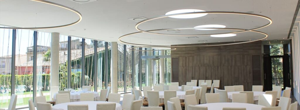 big circular design lamps in restaurant, made in barcelona by insolit