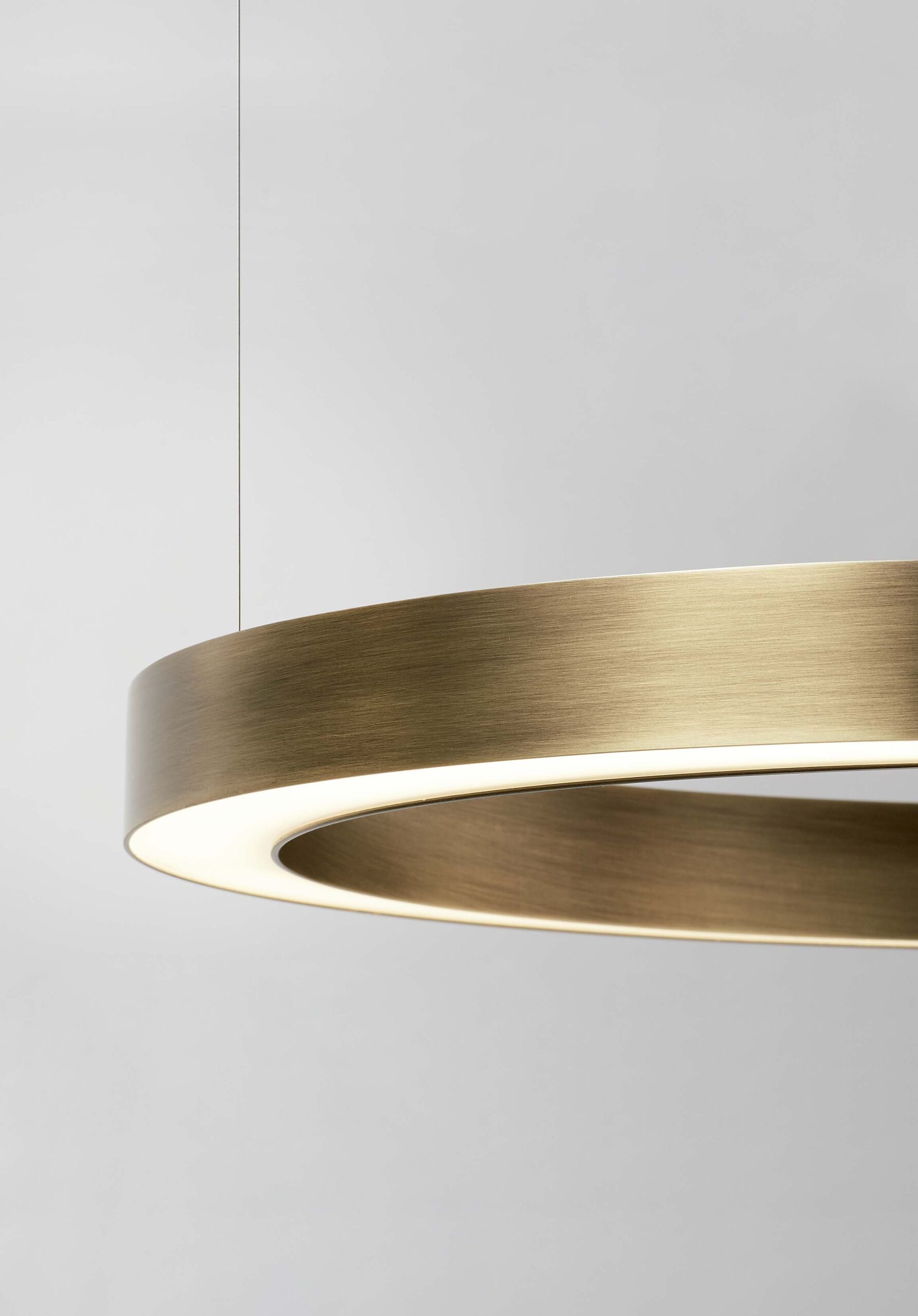 TR circular architectural pendant light in bronze by Insolit